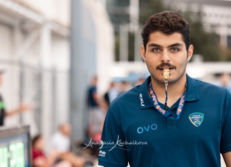 Amir Moradi poolside in Australian Water Polo League team kit, whistle in mouth