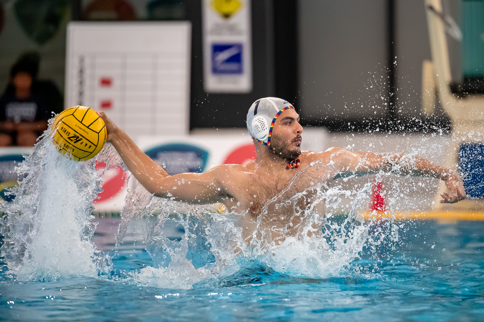 Amir rising out of the water with the ball, ready to pass