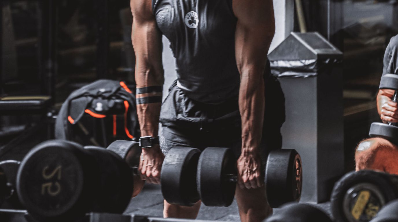 Water polo player performing gym-based strength and conditioning training