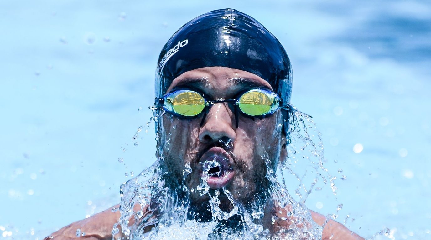 Adult swimmer surfacing during freestyle stroke