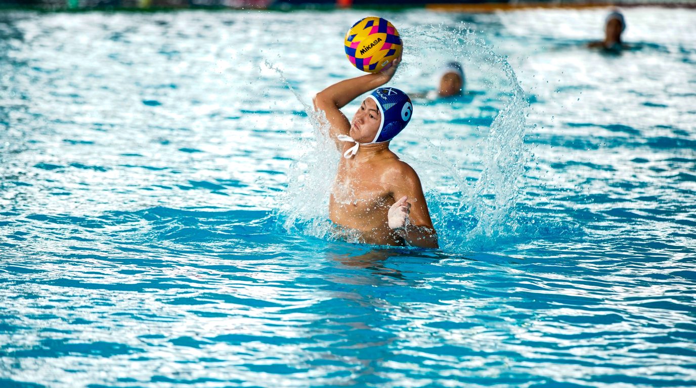 Water polo player throwing the ball